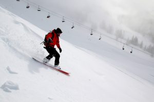 snowboarder going down a mountain